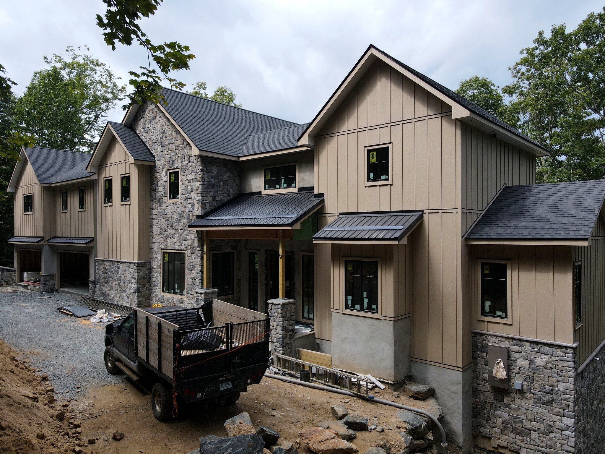Craftsman mountain home exterior with stone and timber framing